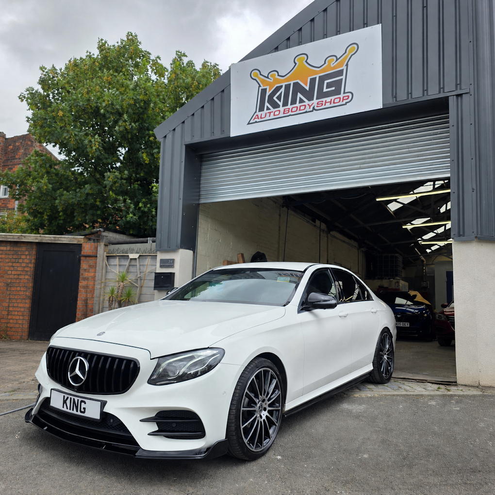 White Mercedes outside the workshop