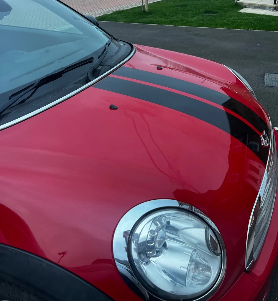 red Mini Cooper bonnet before and after paintwork restoration after repair