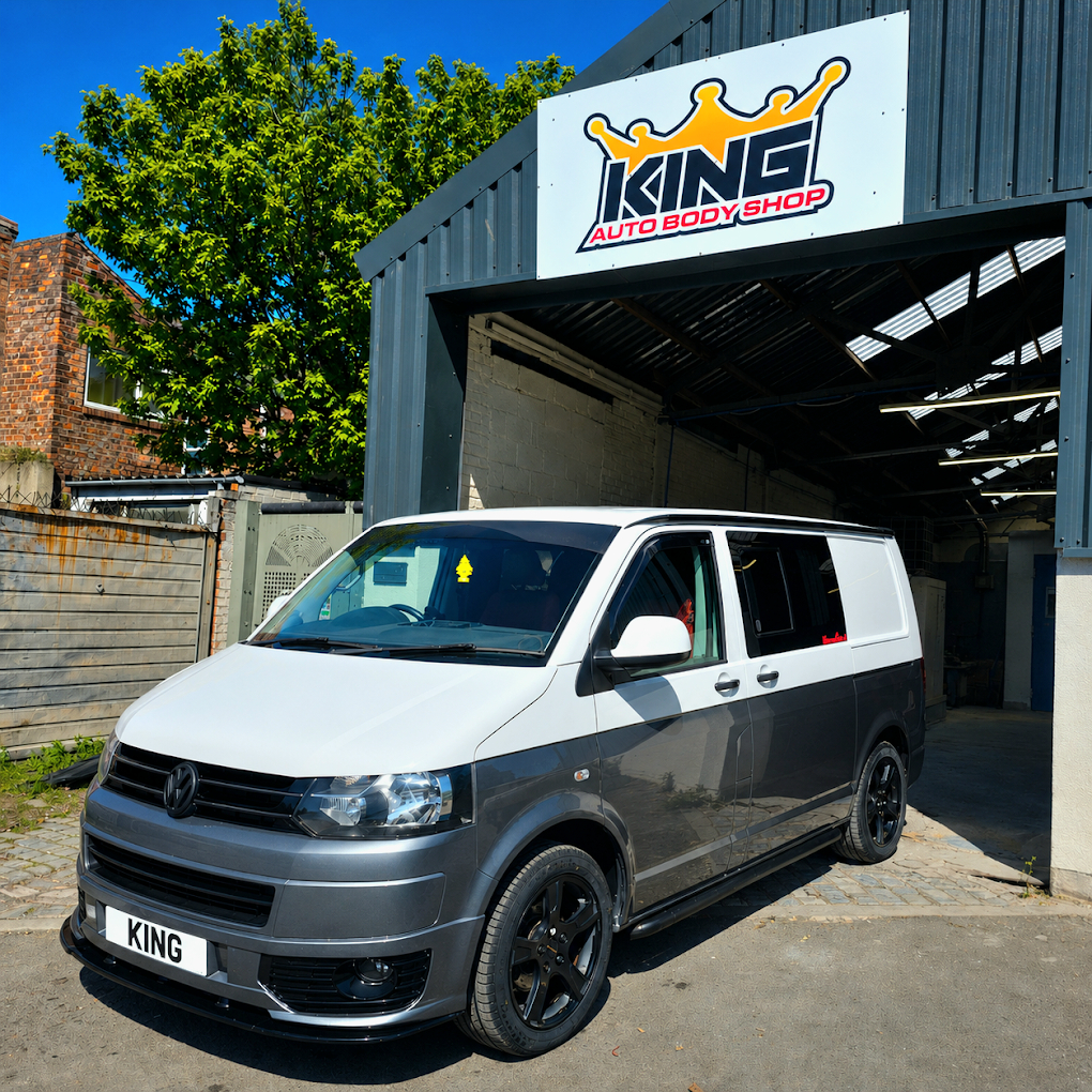 Two-tone Volkswagen van outside the workshop