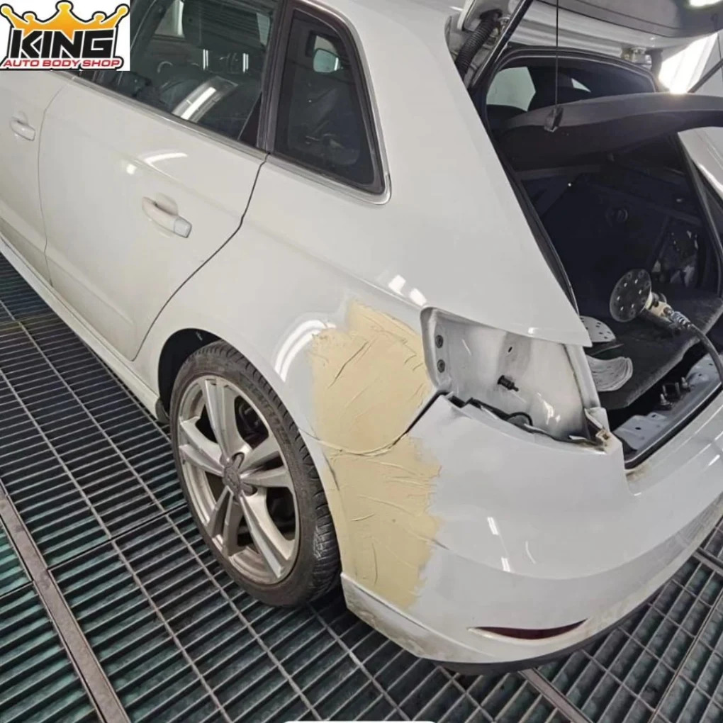 white Audi A3 rear quarter and bumper before repair