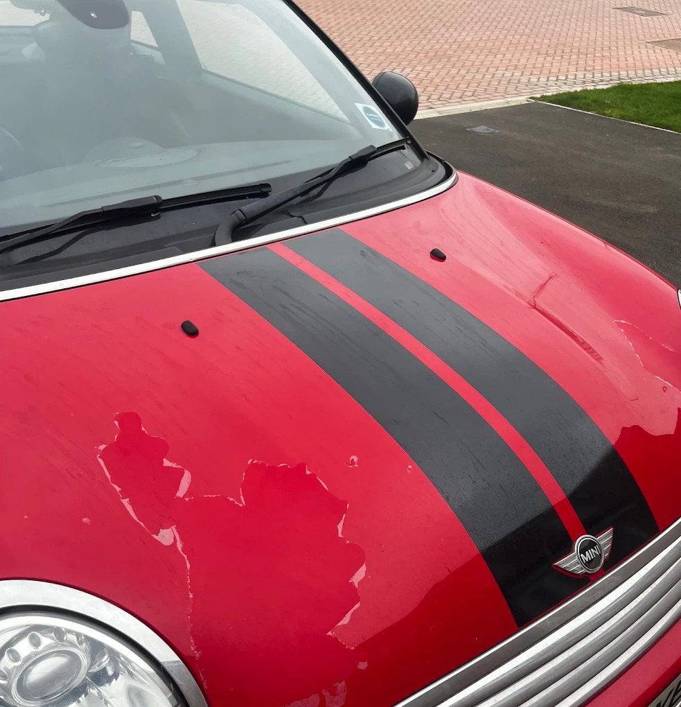 red Mini Cooper bonnet before and after paintwork restoration before repair