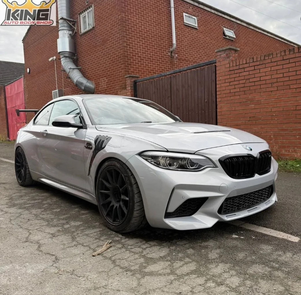 White BMW outside the workshop