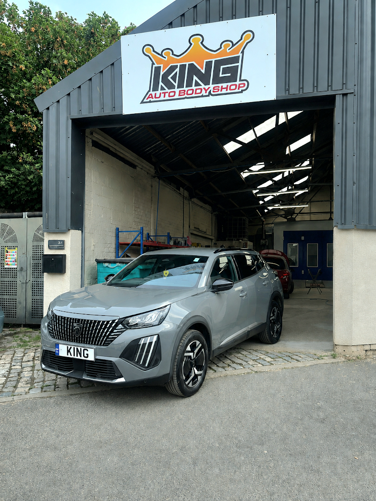 Grey car outside the King Auto Body Shop workshop